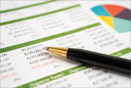 close-up of a financial statement with a pen