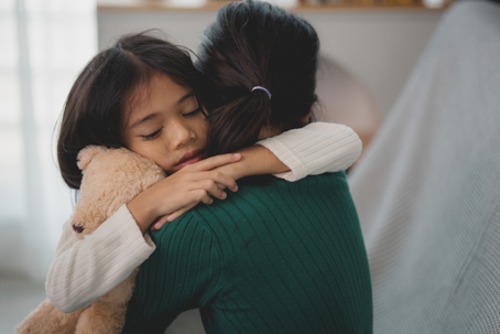 mother and daughter hugging