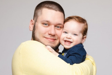 A man hugging a baby