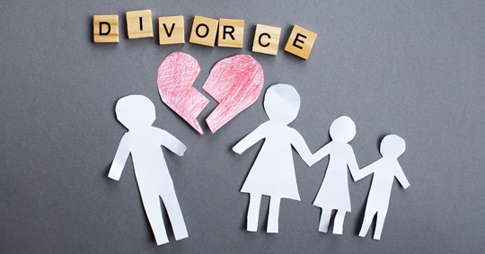 A broken heart and the word "DIVORCE" are above paper cutouts of a family.