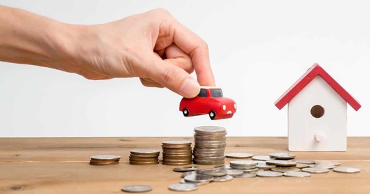 a mini house, car, and coins