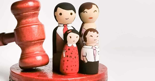 miniature of a family and a gavel