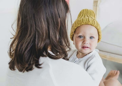 A woman holding a baby