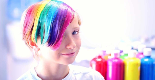 a kid with rainbow hair