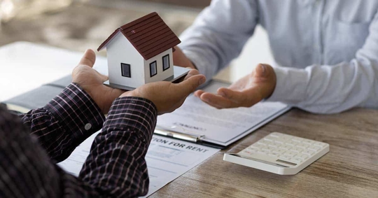 a miniature house with two men