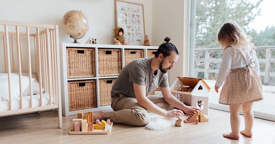 A father playing with his daughter